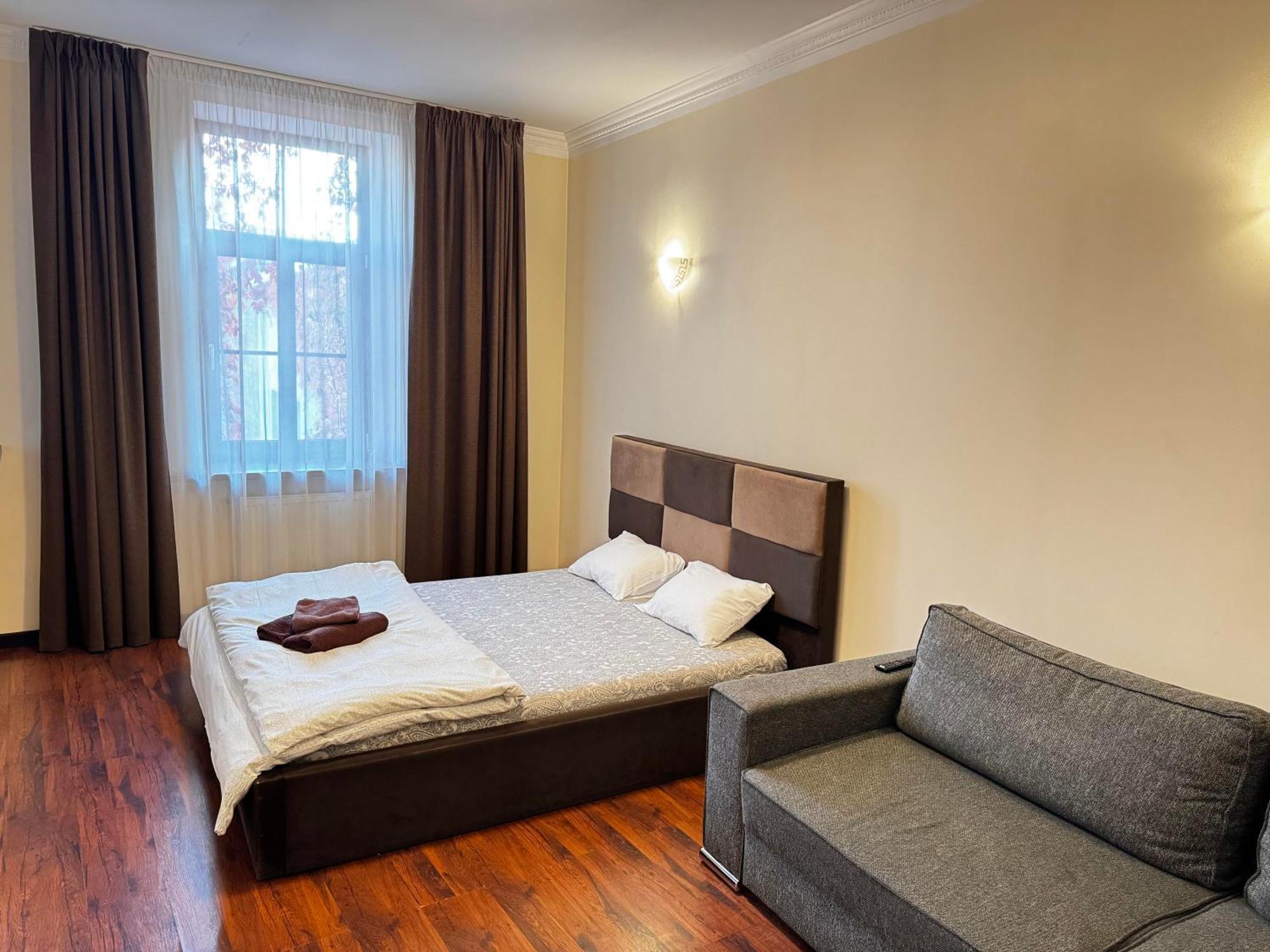 Aparthotel Riga Buitenkant foto A bedroom in a hotel